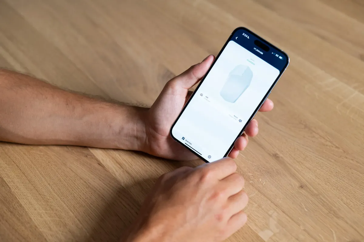 Person using the Plugchoice app on their phone