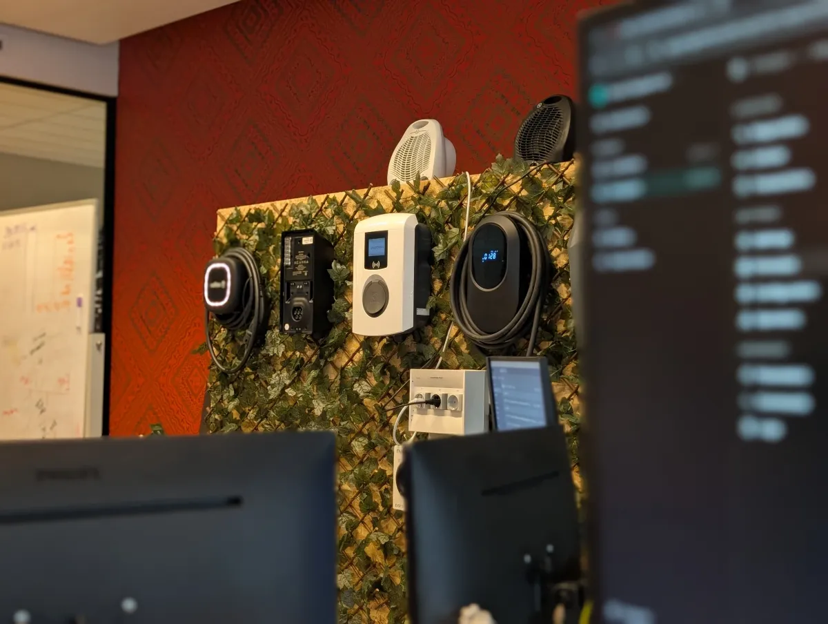 Wall of EV chargers with computer screen