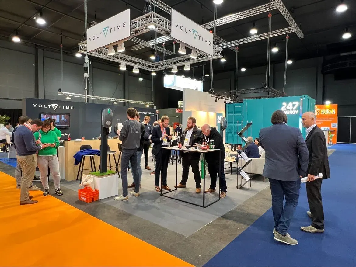 Visitors at the Volt Time stand at an industry fair